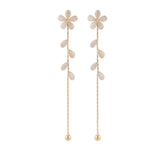 Chic gold plated floral drop earrings embellished with Cats Eye and Cubic Zirconia, perfect for special occasions or everyday wear.